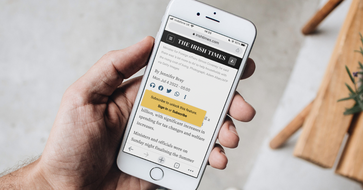 Person viewing The Irish Times audio subscription wall on iPhone